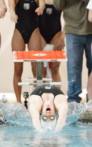 Missy Franklin diving in for her specialty —
the backstroke.
