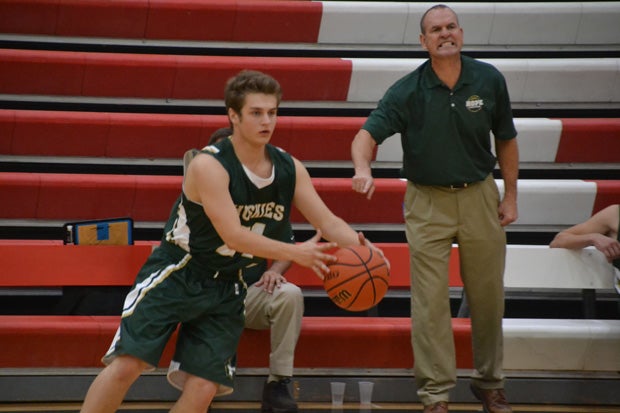 Coach Jim Murphy, shown here in the background, has led Hope Christian's legacy with stellar enthusiasm.