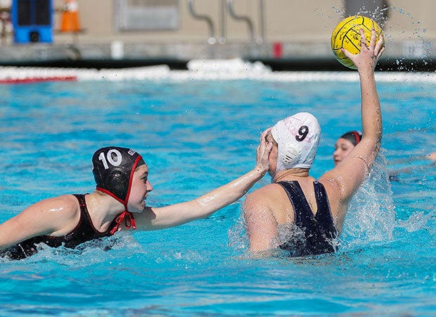 A Glendora (Calif.) defender covers the face of a St. Lucy's player looking to pass the ball.