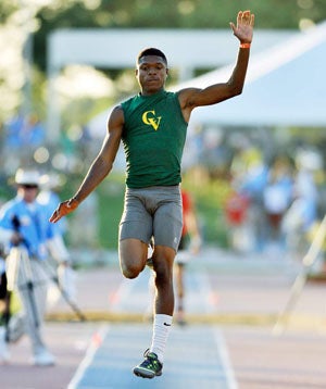 Nate Moore wins the long jump for second
straight season. 