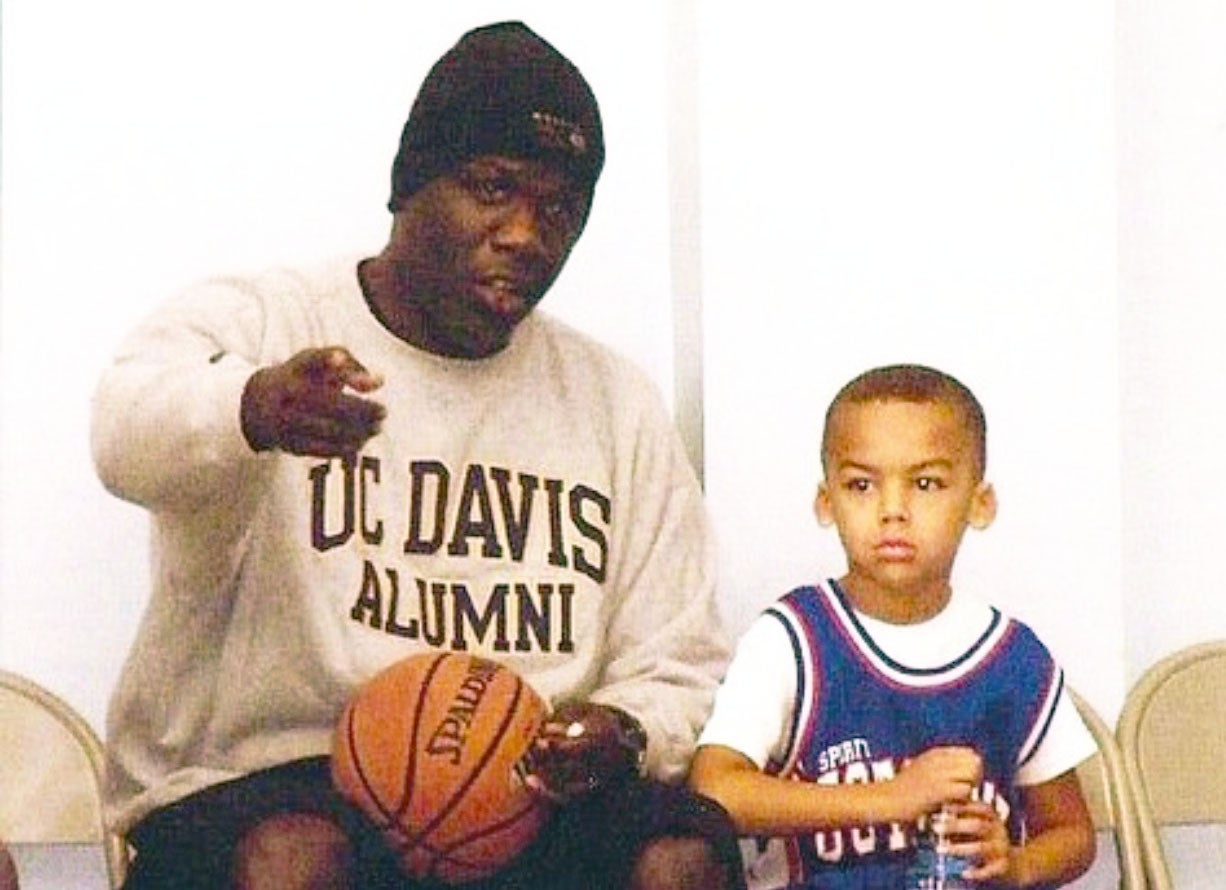 Ahlee directing Jalen in elementary school.
