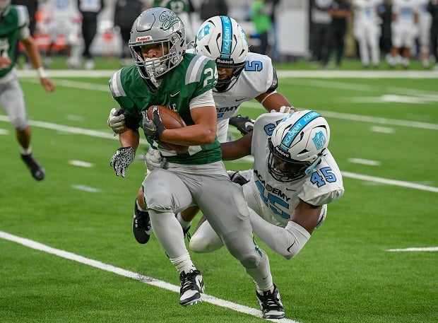 Duece Jones-Drew, son of De La Salle legend Maurice Jones-Drew, looks to pick up more yardage in the Spartans' game against NFL Academy in England on Tuesday. (Photo: Ian Muir)