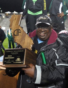Legendary coach Don Norford celebrates
Poly's third shared boys and girls
team title.