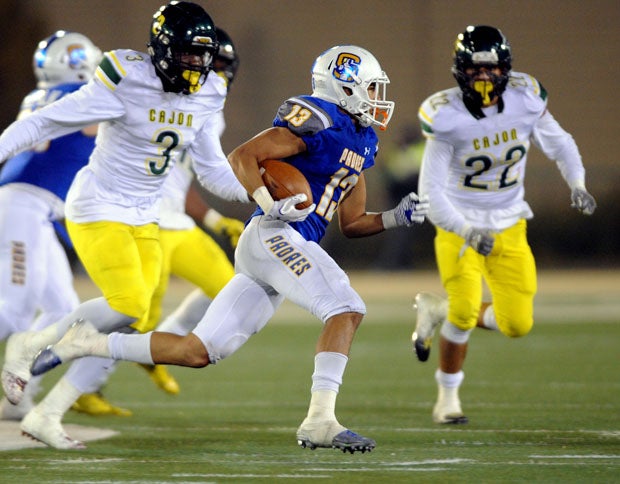 Serra running back rushed for 110 yards and three scores but didn't get far from Cajon's Jeremiah Martin (3) or Fermin Mauricio (22).