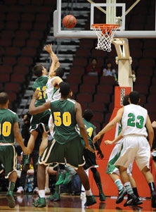 Sam Engler goes up for his game-
winning basket after a pass from
Dewayne Russell.