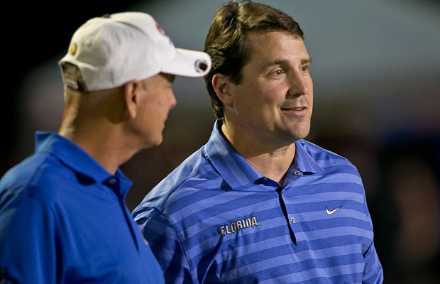 University of Florida coach Will Muschamp (right) was there not only to watch his future prized running back Kelvin Taylor, but to take a look at some other possible recruits as well. Unfortunately for Muschamp and the Gators, Yulee's Derrick Henry is taken. He committed to Alabama earlier in the day.