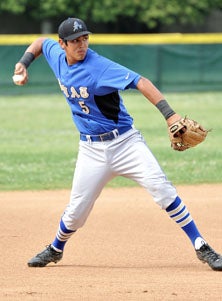 Rio Ruiz, who has been clocked in
the low 90s as a pitcher, shows
off his arm from third base.