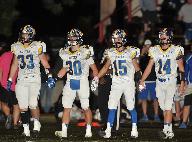 Brayden Hungrige (33), Riley Vickner (30), Micah Cervantes (15) and Randy Post, Sutter