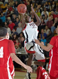 Salesian's Jabari Bird hangs.