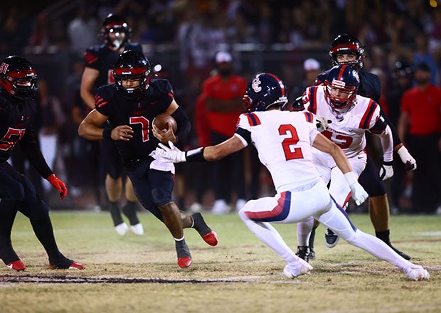 Bruzon evades tacklers in Liberty's fourth straight win over rival Centennial. (Photo: Kevin French)