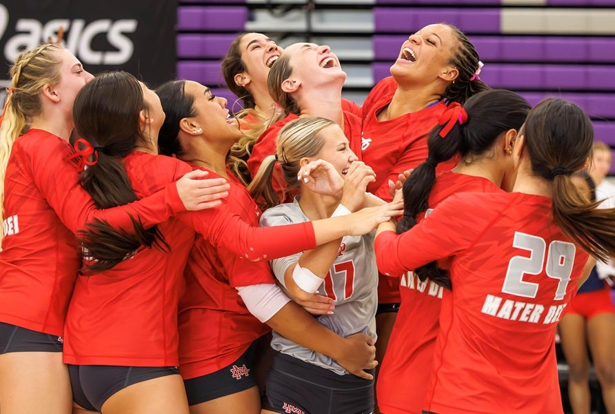 Mater Dei players celebrate their Durango Fall Classic championship. The 23-0 Monarchs jump to No. 1 in the latest MaxPreps Top 25 after sweeping Sierra Canyon in the final. (PHOTO: Jenni Webber)