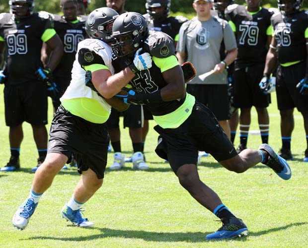 Bentley Spain (left) of Providence (Charlotte, NC.) tries to hold off Jalyn Holmes of Lake Taylor (Norfolk, Va.) in Tuesday's Lineman Challenge.