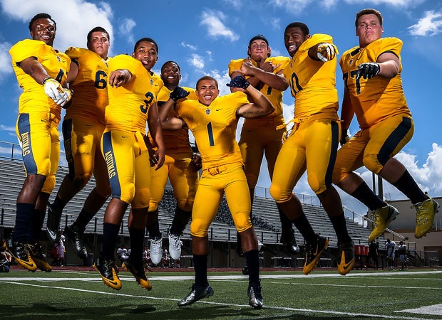 Some top players from St. Thomas Aquinas clown around during a recent photo shoot.