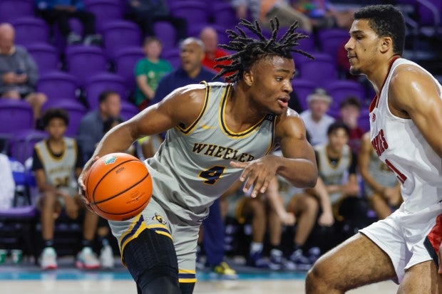 Top-ranked senior prospect Isaiah Collier finished with 16 points, eight rebounds and six assists in No. 9 Wheeler's 57-53 win over No. 5 Corona Centennial on Monday at the City of Palms Classic. (Photo: Pete Wright)