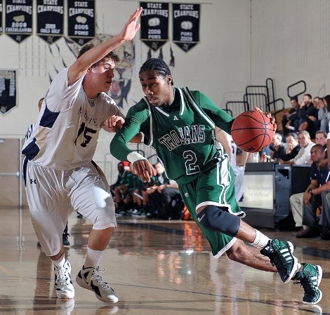 Aurora Central standout Carlton Hurst (2) has worked to improve his all-around game after a tough ending to the Trojans' 2011 season. Hurst has signed to play at Colorado State.
