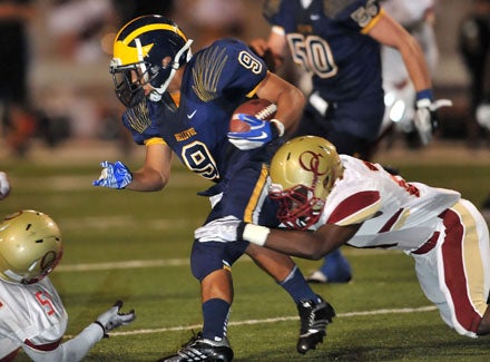 John Nguyen (9) wouldn't be denied most of the night and rushed for two TDs, including the clincher.