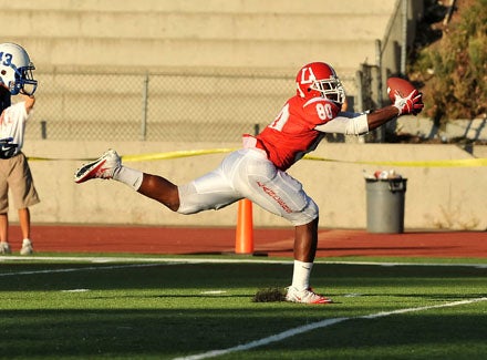 Orange Lutheran tight end Miles Willis completes his circus 25-yard touchdown catch. 