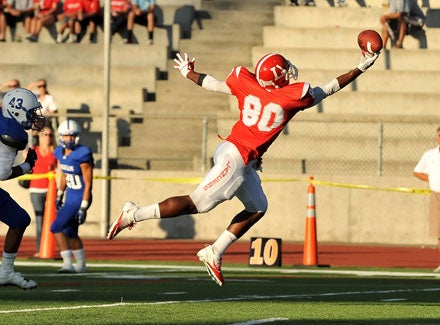 Orange Lutheran tight end Miles Willis goes after 25-yard touchdown pass from Conner Sullivan.  