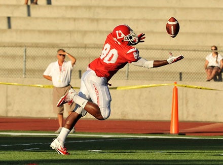 Lutheran tight end Miles Willis stretches after his own tip. 