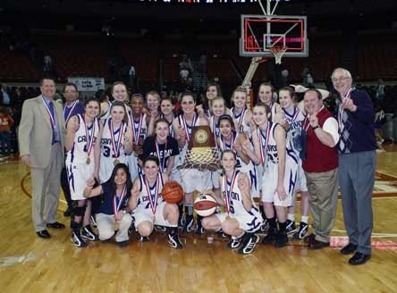 Joe Lombard (far right) and his players ran the table in Texas at 38-0. That earned the legend the MaxPreps Girls Basketball Coach of the Year award.