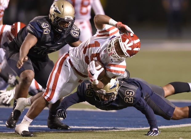 Mater Dei running back Shakobe Harper fights for yardage.