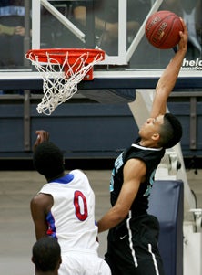 Deer Valley's Kendall Smith goes up
for a dunk.