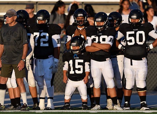 Zack Schreiter looks on from the sideline during his team's season-opening loss to Olympus last Friday.