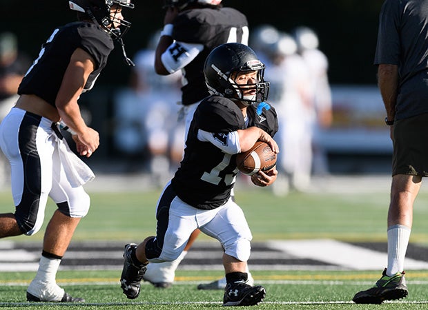Schreiter carries the ball during pregame warm-ups.