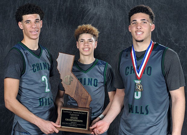 Lonzo, LaMelo and LiAngelo Ball – perhaps the best brother act in high school basketball history – pose with the state championship trophy after the game.