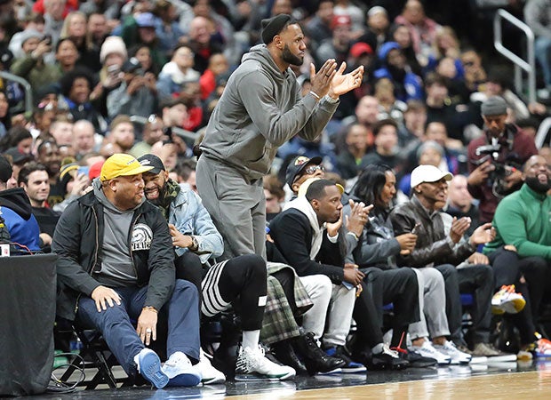 LeBron James cheers on his son's team during Saturday's game at Nationwide Arena.