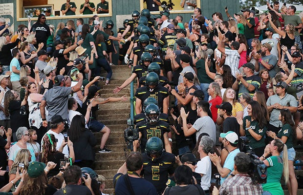 With Johnny Cash's "God's Gonna Cut You Down" blaring, the Bobcats made a dramatic entrance into Om Wraith Field on Friday night. 