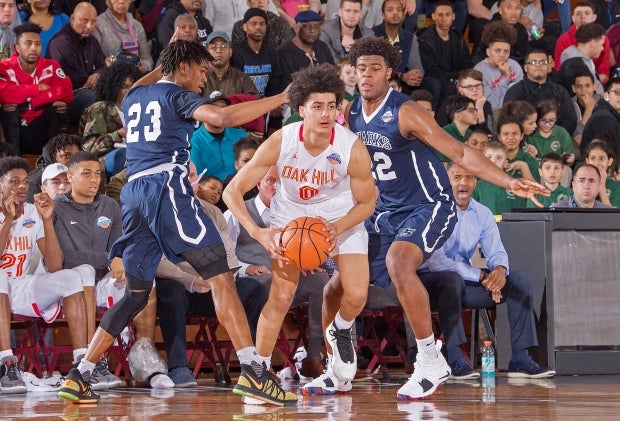 Trey Doomes and Vernon Carey Jr. of University attempt to trap Will Richardson of Oak Hill Academy.