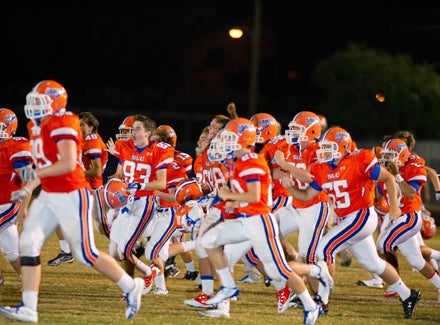 St. Louis of Lake Charles, shown here celebrating a big victory in 2011, was far more impressive in its altruistic nature last week, donating more than $5,000 to the East St. John program.