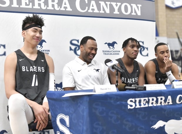 Sierra Canyon head coach Andre Chevalier answers questions at the program's media day in October along with Harold Yu (far left), Terren Frank and Amari Bailey.