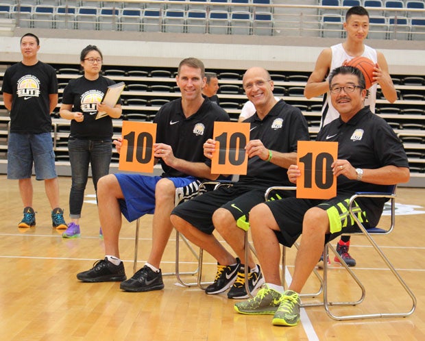 Basketball coaches (L-R) Tim Kennedy, Frank Allocco and Harvey Kitani double as slam dunk contest judges at the Nike High School Elite Camp in Shangai. 