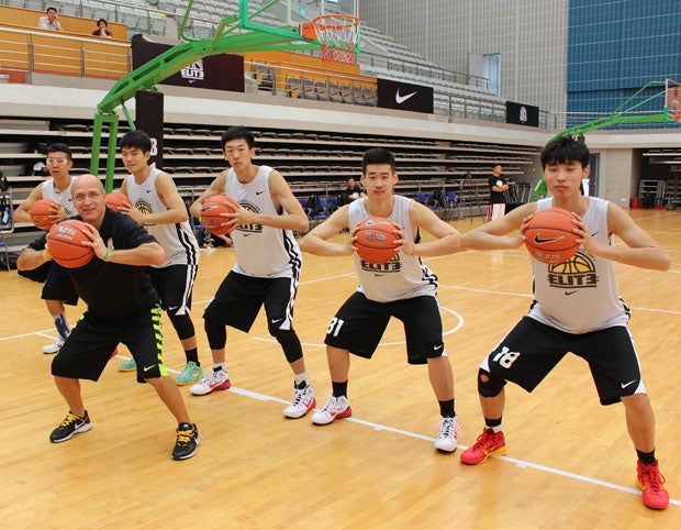 Coach Frank Allocco with the big men in Shangai. 