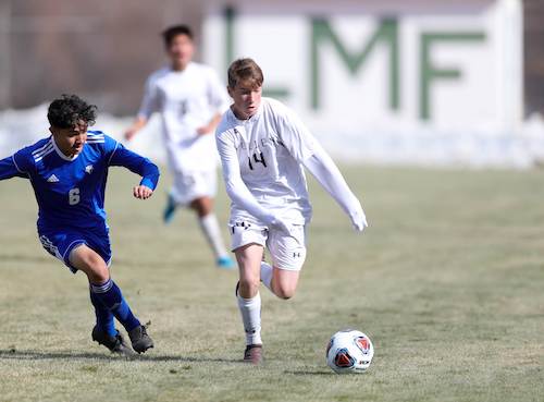 Mullen senior Eli Kerschen (right) already has tallied seven goals in only two games for the Mustangs this season.