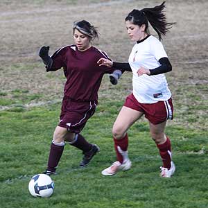 Yesenia Samano (right) goes up against an opponent during the first half