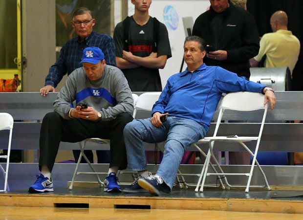 Kentucky's John Calipari (right) and an assistant look on during a game on court 1.