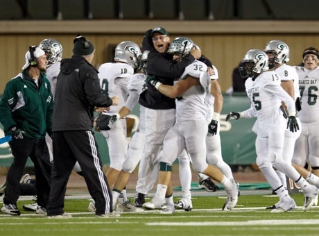 Granite Bay's Ernie Cooper, shown here in the 2012 Sac-Joaquin Section title game, has announced his retirement from coaching.