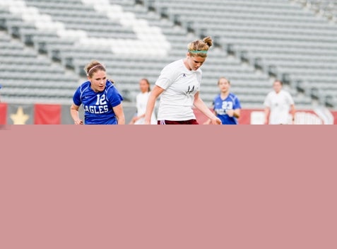 Cheyenne Mountain standout Hannah Gerdin (white jersey) has scored 19 goals and tallied 16 assists this season. The Indians are after their third consecutive Class 4A state title as the postseason begins.