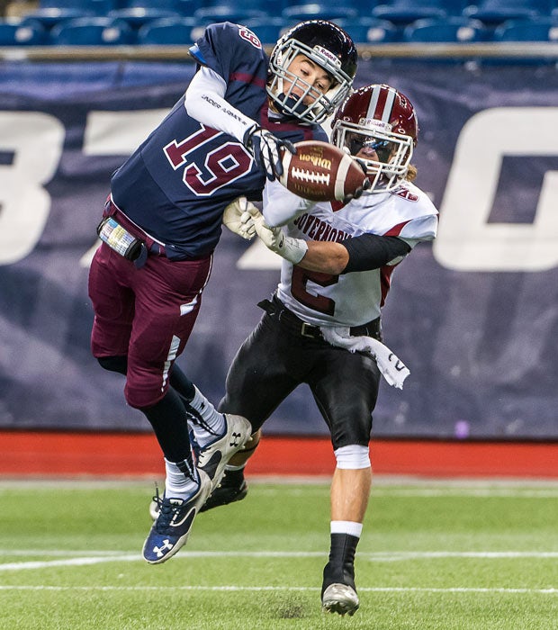 Belmont (Mass.) receiver Jackson Bobo makes a spectacular reception in front of a Governor's Academy defender.