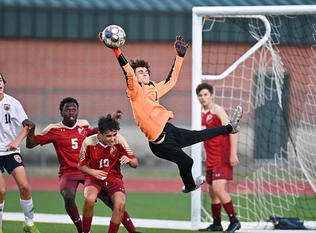 Cypress Woods (Texas) goalkeeper Zac Cannon makes an amazing save in traffic against rival Bridgeland. 