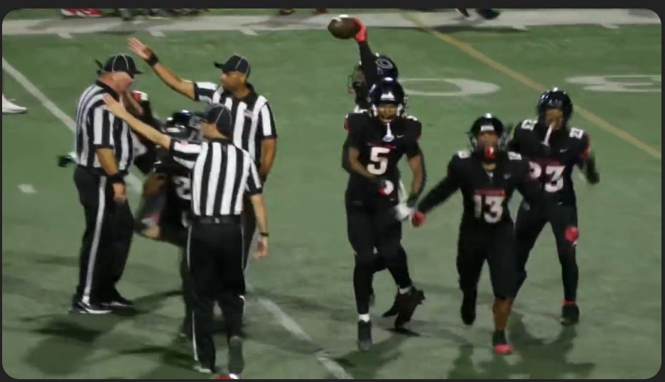 Centennial players head to the sideline in celebration after a controversial interception call late in the game against Mater Dei. (NFHS Network)