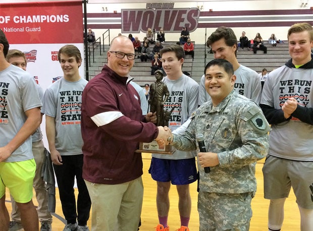 Chris Schremp accepts the Minuteman Trophy as part of the Tour of Champions presented by the Army National Guard.