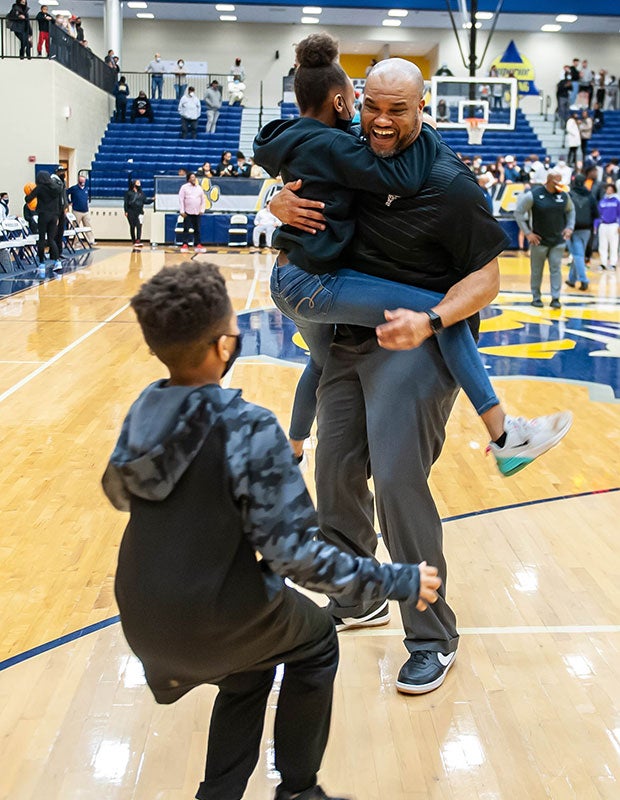 Kell (Ga.) head coach Jermaine Sellers celebrates with his children after his team's GHSA Region AAAAAA championship victory over Wheeler.