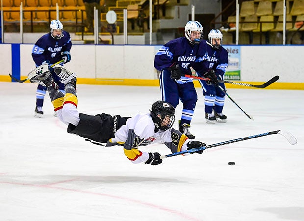 Ryan Twist of Mount Olive (N.J.) dives while battling for possession of the puck.