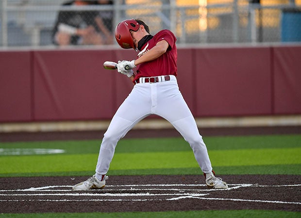 A wild pitch knocks the helmet of Carson Smith of Cypress Woods (Texas) askew.  Luckily, he only suffered a bruised cheek.  