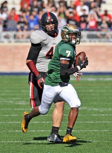 DeSoto receiver Rickey Daniels
is heading to the end zone after
the fine catch. 