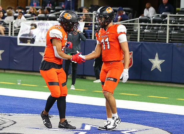 Jaxon Smith-Njigba (11) receives congratulations for one of his six touchdowns, five receiving, in Friday's 60-59 win over Allen.